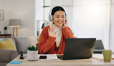 female employee remote worker using headset and on a company video call