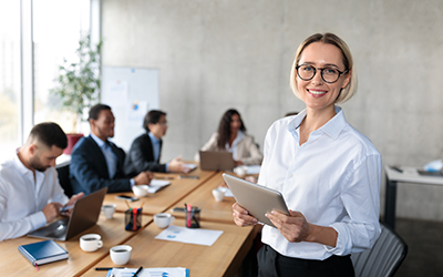 business instructor teaching employees at a meeting