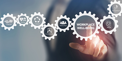 gears with the words workplace wellness inside one of them