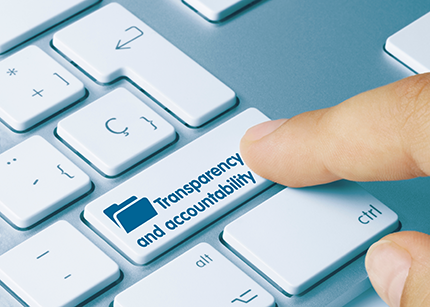 photo of a keyboard with one key labelled transparency and accountability