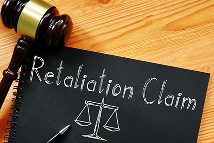 photo of a gavel sitting on top of a file named retaliation claim