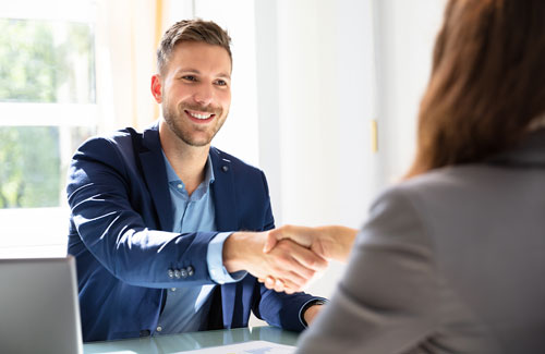 photo of hr consulting professional shaking hands with a client