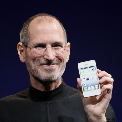 Picture of Steve Jobs holding the iPhone. 