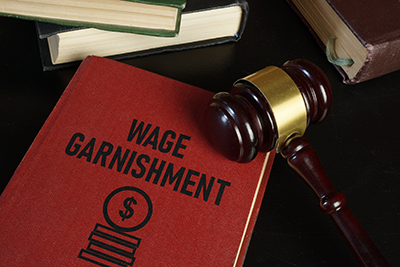 wage garnishment legal manual with judges gavel on top